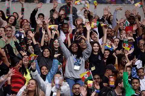 Fans wave flags during Brazil Floods charity match